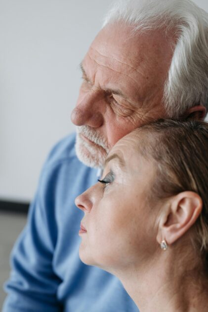 Two older adults sharing a close moment, representing family members who may become intestate heirs when no will exists.